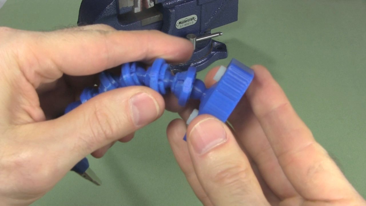 Putting the magnetic holder's ball into the helping 3D printed hands socket.