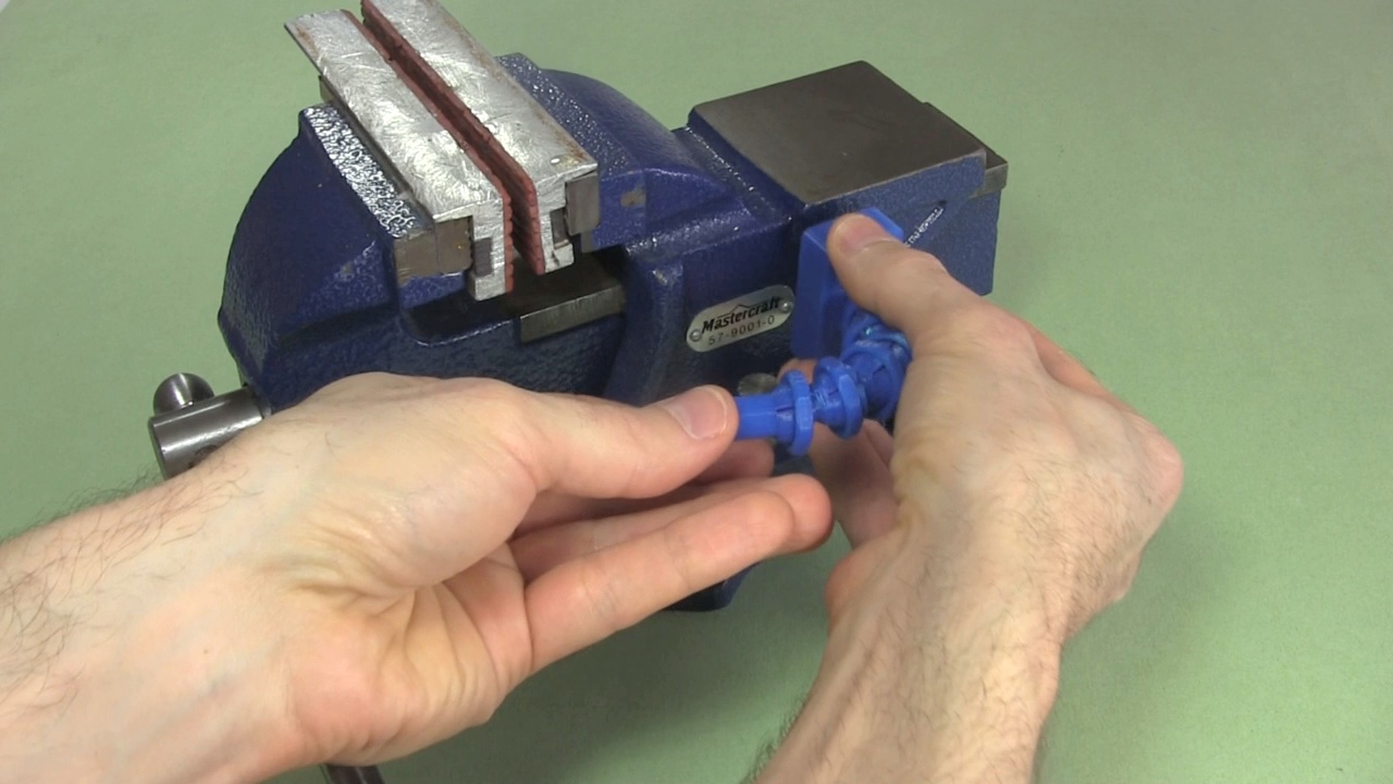 Putting the 3D printed helping hands on the vice.