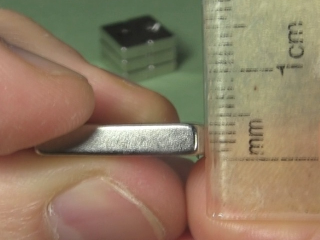 Using a ruler to show 4mm tall neodymium magnets.