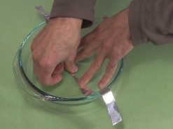 2. Tape the long strip into the bowl for the ball cyclotron/
      electrostatic accelerator.