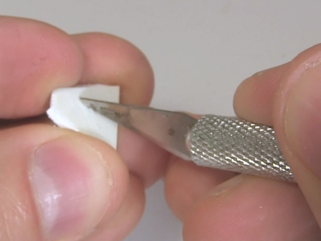 Roughening the plastic wedge by scratching it with an X-acto knife.
