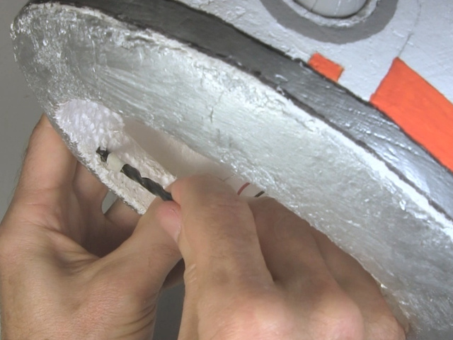 Drilling a bolt hole in BB-8's styrofoam head by just twisting the drill bit by hand..