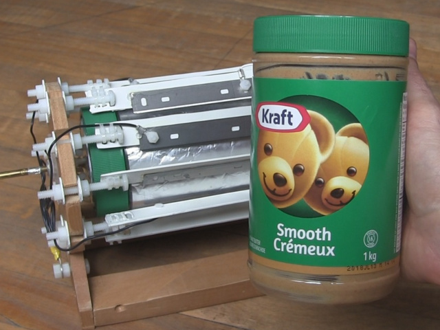 Showing a Kraft peanut butter jar beside the corona motor.