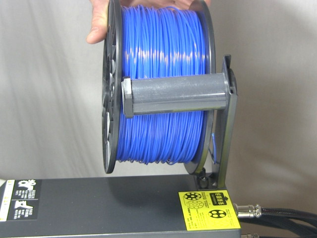 Showing that the CR-10's filament spool tube is too short for the spool I bought.