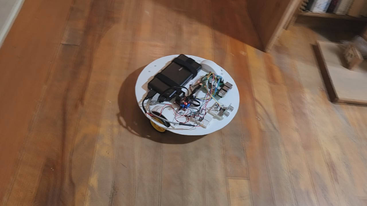 3-wheeled robot roaming around the floor.