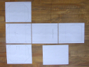 Photo of the 5 template sheets in poster-board-pinhole-camera-template-v1.pdf.