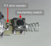 The resistor and switch inside the laser pointer.