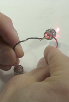 Testing the laser diode with a stack of batteries.