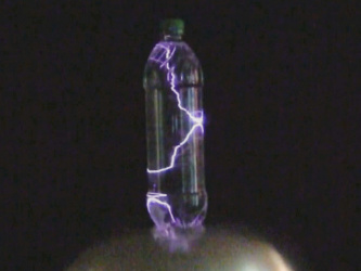 Lightning in a bottle on top of a Van de Graaff generator.