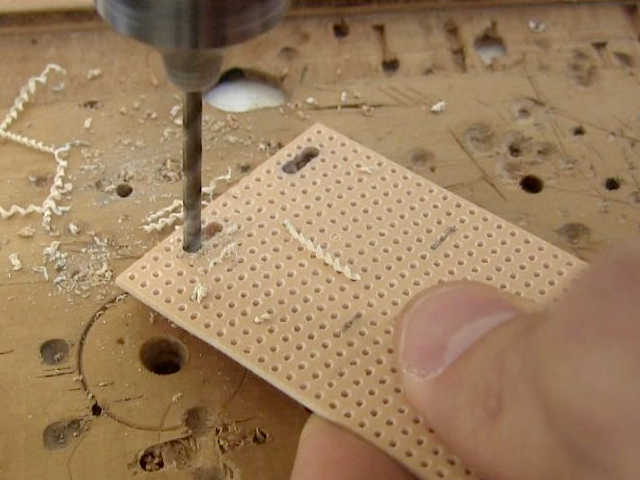 Drilling 4 slots for tie straps for the crystal radio amplifier's 9 volt battery.