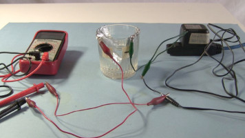 Forming aluminum oxide on positive plate of the simple homemade electrolytic capacitor.