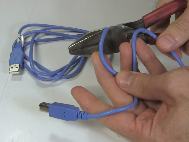 Cutting the unwanted connector using wire cutter pliers.