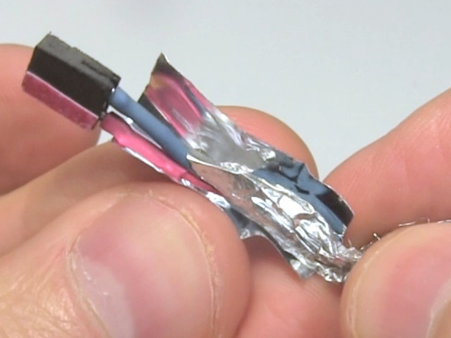 Wrapping the foil on the wires of the USB cable.