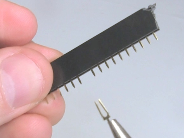 Showing the fork-shaped pin removed and the space left behind.