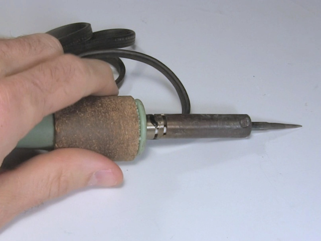 Soldering iron with a pointy tip.