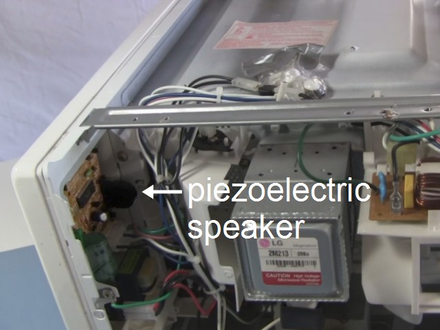 The location of the piezoelectric speaker in a microwave oven.