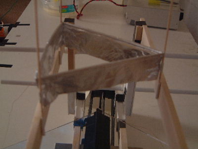 The legs of the lifter snugly held in place in plastic tubes on the test rig.